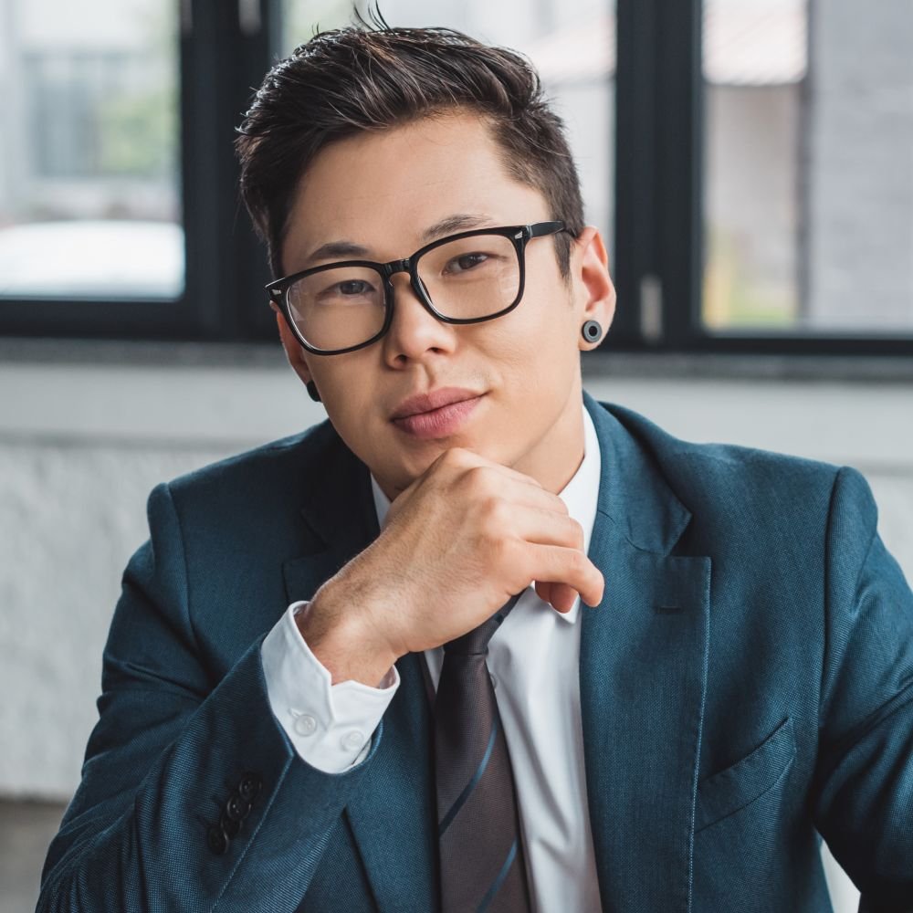 Handsome Young Asian Businessman In Suit And Eyegl QNR7Z5E 1